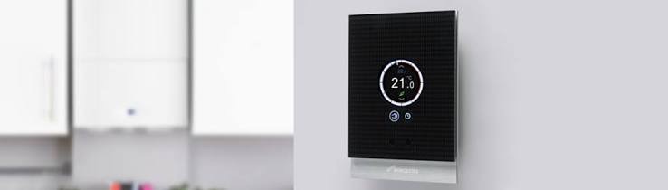 Modern boiler and smart thermostat installed side by side in a stylish home