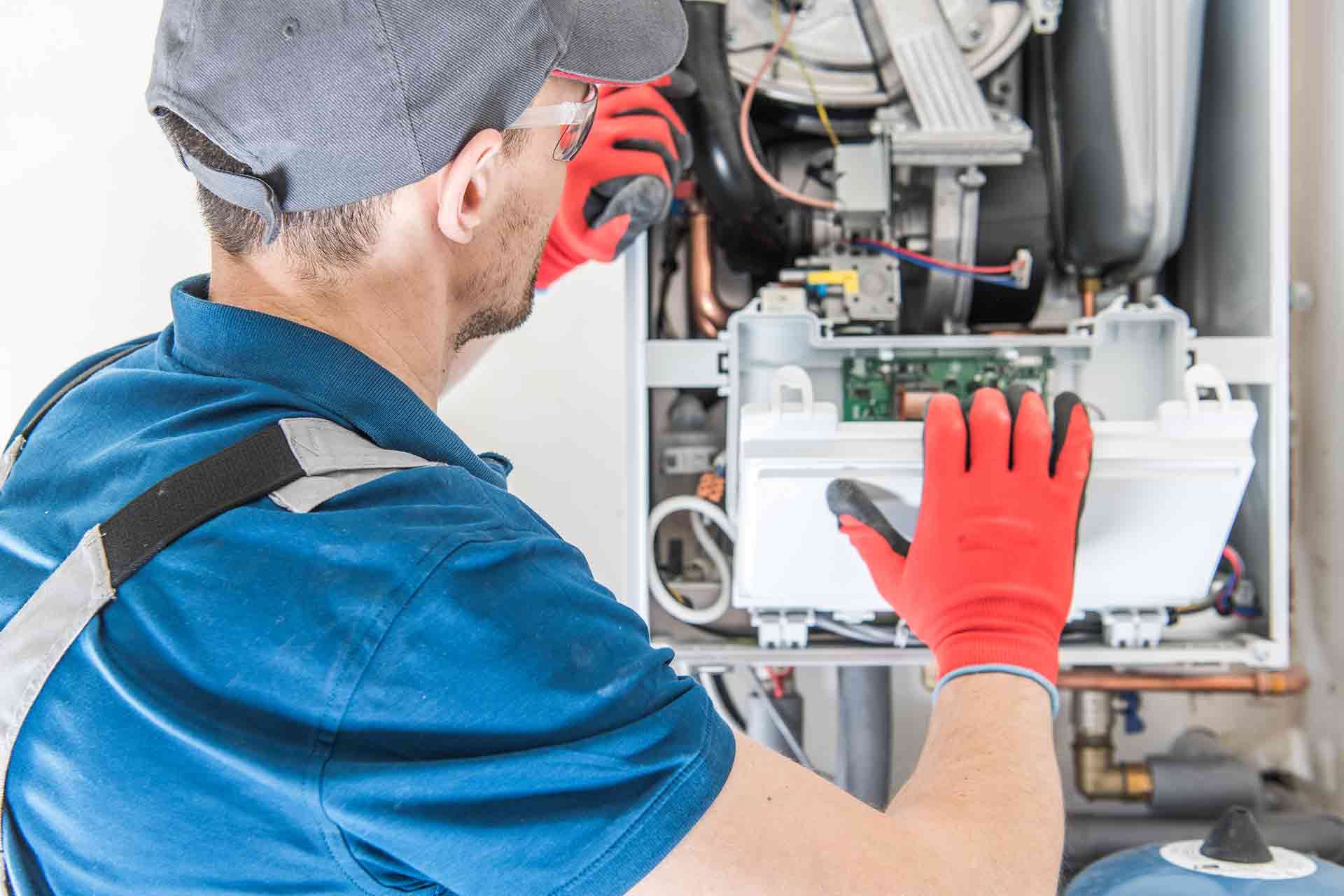 Gas Safe engineer diagnosing a boiler with professional equipment